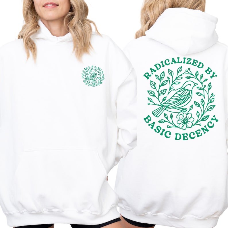 A white hoodie with a green graphic design on the back.