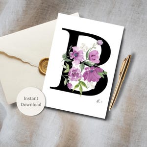May include: A white card featuring a large black letter "B" adorned with watercolor purple flowers and green leaves. A gold pen and a cream-colored envelope with a gold wax seal are next to the card. The words "Instant Download" are on a white circle.