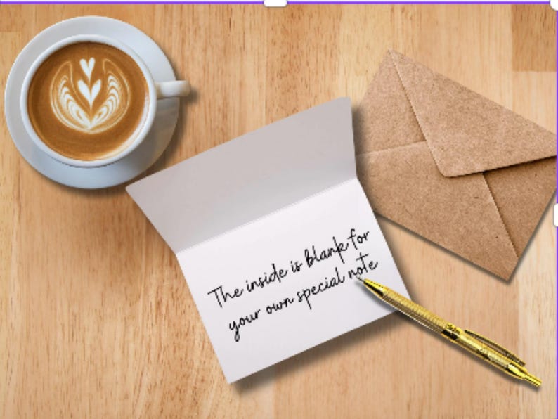 Mockup of a folded card showing a blank white interior for personalized messages, styled on a clean desk with a coffee cup and gold pen.