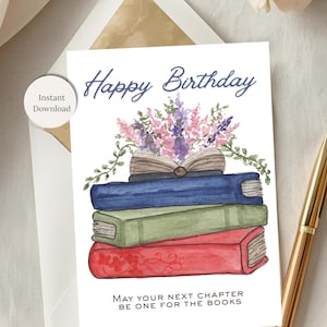 May include: A birthday card with a watercolor illustration of a stack of books topped with flowers. The card reads "Happy Birthday" and "May your next chapter be one for the books."