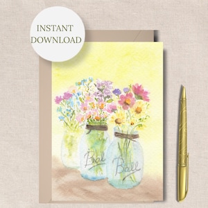 May include: Watercolor illustration of three mason jars filled with colorful flowers. The jars are labeled "Ball" and are tied with twine. The card has the text "INSTANT DOWNLOAD" and is accompanied by a gold pen.