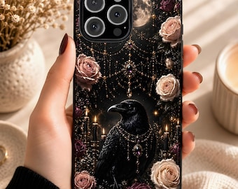May include: Black phone case featuring a detailed illustration of a raven adorned with jewelry, surrounded by roses, candles, and a full moon. The design has a gothic aesthetic with a dark, elegant theme.
