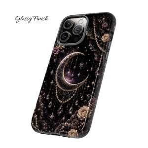 May include: Black phone case with a celestial design featuring a crescent moon, stars, and floral accents. The case has a glossy finish and the words "Glossy Finish" are printed on the upper left corner.