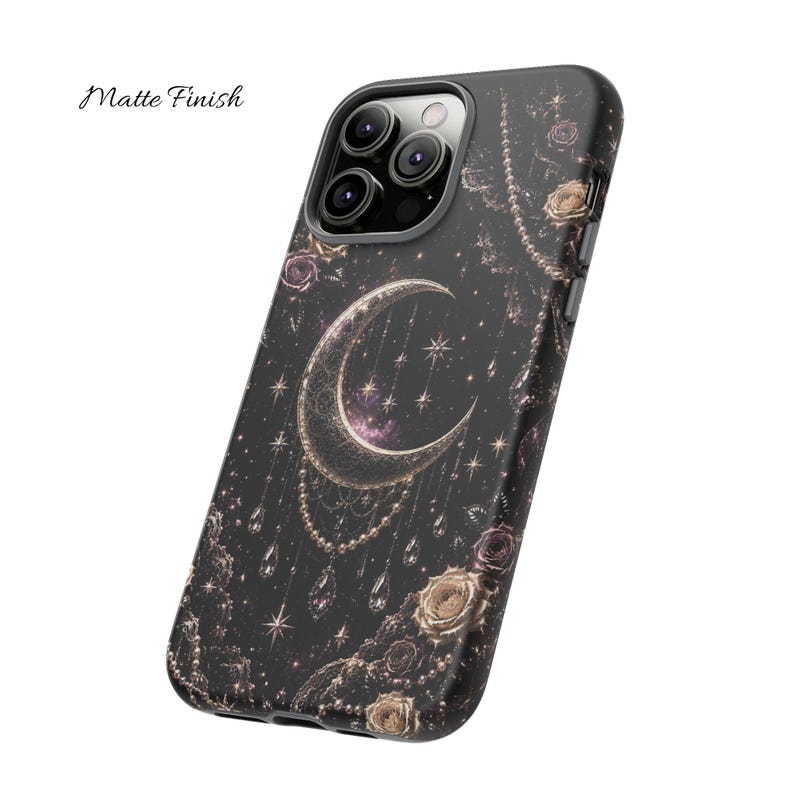 May include: Black phone case with a celestial design featuring a crescent moon, stars, and floral accents. The case has a matte finish and includes the text "Matte Finish".