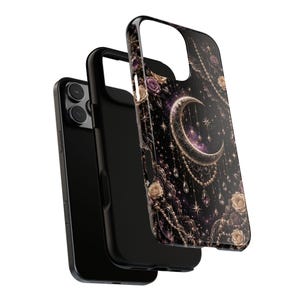 May include: Black phone case with a celestial design featuring a crescent moon, stars, and roses. The case has a protective black inner layer and a decorative outer layer with gold and purple accents.