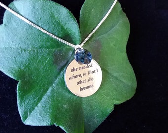 She Needed A Hero, So That's What She Became Necklace - Sterling Silver Chain with Pendant and Blue Swarovski Crystal - includes gift box