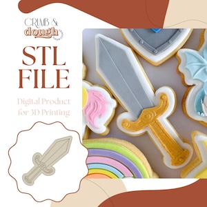 May include: An image of decorated sugar cookies, including a sword, shield, and rainbow. The sword cookie has a silver blade and gold hilt. The image also includes the text "STL FILE" and "Digital Product for 3D Printing".