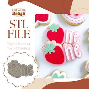 May include: A digital STL file for 3D printing a cookie cutter shaped like a strawberry with the word "one" next to it. The cookie cutter is designed for use with fondant or cookie dough.