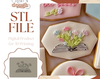 May include: An image featuring decorated cookies with floral designs. The cookies are iced in white and decorated with pink, blue, and green frosting. The text "STL FILE" and "Digital Product for 3D Printing" are also visible.