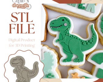 May include: Green dinosaur-shaped sugar cookies with white icing and a detailed design. The cookies are part of a set, with the text "STL FILE" and "Digital Product for 3D Printing" visible in the image. The logo "Crumb & Dough" is also present.