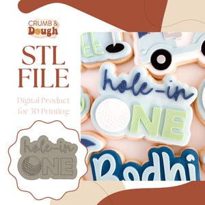 May include: A selection of golf-themed biscuits decorated with blue and green icing spelling "hole-in-ONE". The image also shows golf balls and golf carts. The text "STL FILE" and "Digital Product for 3D Printing" are also visible.