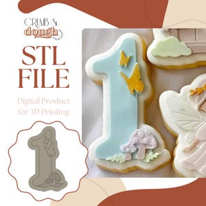 May include: An image of a number one cookie decorated with light blue icing, yellow butterflies, and a mushroom. The image also includes the text "STL FILE" and "Digital Product for 3D Printing".