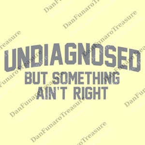 May include: A light yellow background with the gray text "UNDIAGNOSED" arched across the top. Below, the text "BUT SOMETHING AIN'T RIGHT" is centered. The text is in a bold, sans-serif font.