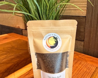 May include: A brown kraft paper stand-up pouch containing dried Tulsi Holy Basil leaves. The label features the text Nature's Remedy Apothecary, Tulsi (Holy Basil), C/S, Ocimum Tenuiflorum, and 5oz. A clear window reveals the dark green herbal contents.
