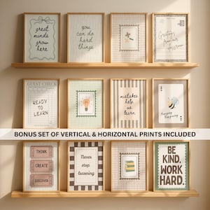 May include: A collection of twelve framed wall art prints displayed on three wooden shelves. The prints feature various educational and motivational phrases, illustrations of lightbulbs, books, a bee, and ticket stubs in neutral tones.