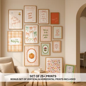 May include: A gallery wall featuring a collection of framed art prints with autumn themes, including pumpkins, bows, leaves, and text like 'Let's Get Cozy' and 'Happy Thanksgiving'. The prints are displayed in light wood frames on a beige wall.