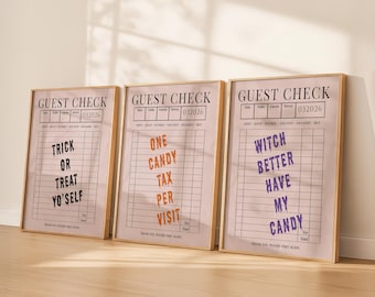 Puede incluir: Tres impresiones enmarcadas con fondo rosa claro y marcos dorados. Cada impresión tiene un encabezado "GUEST CHECK" y un texto único con temática de Halloween: "TRICK OR TREAT YO'SELF", "ONE CANDY TAX PER VISIT" y "WITCH BETTER HAVE MY CANDY".