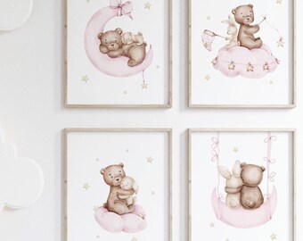 May include: Four framed prints with a pink and white colour scheme featuring illustrations of bears and bunnies on clouds with stars. The prints are arranged in a grid pattern on a white wall.