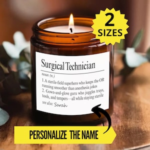 May include: A lit candle in a brown glass jar with a white label. The label reads "Surgical Technician" with a definition. A yellow banner at the bottom says "Personalise the Name". A yellow starburst indicates "2 Sizes".