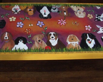 May include: A painted wooden coffee table with a purple background and a variety of dog breeds painted on it. The dogs are surrounded by flowers and the words "sniff the flowers", "free hugs", "squirrel", "play ball", "carolina family", "steal the bacon", "yellow the dachshund", and "hauntsville".