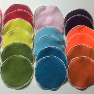 May include: A set of 18 round fabric circles in various colors, including pink, red, yellow, green, blue, purple, orange, and brown. Each circle has a white stitched border.