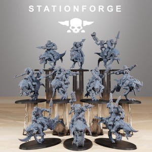 May include: A collection of gray miniature figurines, including riders on various creatures and vehicles. The figurines are displayed on black bases, with the "STATIONFORGE" logo and a skull emblem at the top.