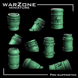May include: A collection of green miniature terrain pieces for tabletop gaming. Includes cylindrical barrels, angled pipes, and containers with skull details. The text "WARZONE MINIATURE" and "PRE-SUPPORTED" are visible.