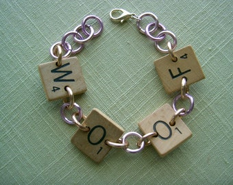 Scrabble Tile Bracelet Woof with Purple and Copper Aluminum Rings Handpainted Dog Paws Upcycled Recycled Game Pieces Adjustable