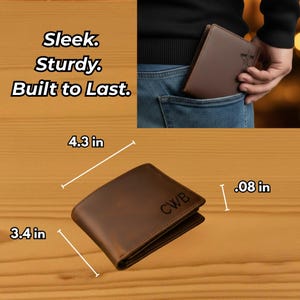 May include: A brown leather wallet with the initials CWB engraved on the front. The wallet measures 4.3 inches by 3.4 inches with a thickness of 0.08 inches. Text on the image reads: Sleek. Sturdy. Built to Last.