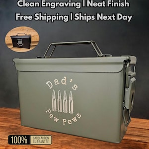 May include: An olive green steel ammo box with a black handle and latch. The box features the text "Dad's Pew Pews" with bullet illustrations. Additional text includes "Clean Engraving" and "Authentic Steel".
