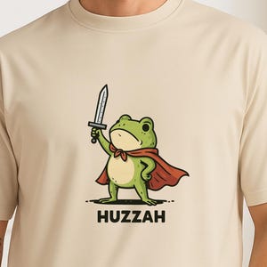 Leap into battle (or laughter) with this whimsical Frog Knight T-Shirt – perfect for lovers of Dungeons & Dragons,  and medieval mayhem with a quirky twist. Whether you're a bard in the tavern or a rogue at the table, this amphibious adventurer is sure to win hearts.
A proud frog dressed in knight armor, holding a sword or banner, shouting “Huzzah!” — styled with medieval fonts or surrounded by lily pads, scrolls, or magical flourishes as a gift for your favorite dice-rolling frog fanatic.