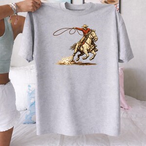 🤠 Houston Rodeo 2026 Shirt – Comfort Colors® 1717
Get rodeo-ready in true Texas style 🤎⭐
This Houston Rodeo 2026 Shirt is made for western moms, cowgirls, and rodeo lovers who live for boots, bucking horses, and arena nights.
With its retro southwestern vibe, this tee is perfect for rodeo season, country concerts, and everyday western fashion.Features a vintage-inspired western graphic with bold rodeo energy — perfect for Houston Rodeo outfits, cowgirl aesthetics, and wild west vibes.