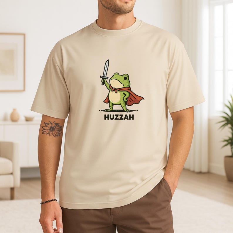 Leap into battle (or laughter) with this whimsical Frog Knight T-Shirt – perfect for lovers of Dungeons & Dragons,  and medieval mayhem with a quirky twist. Whether you're a bard in the tavern or a rogue at the table, this amphibious adventurer is sure to win hearts.
A proud frog dressed in knight armor, holding a sword or banner, shouting “Huzzah!” — styled with medieval fonts or surrounded by lily pads, scrolls, or magical flourishes as a gift for your favorite dice-rolling frog fanatic.