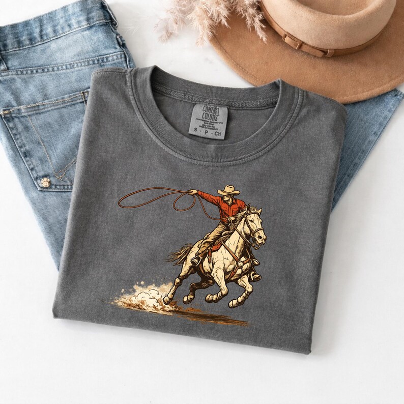 🤠 Houston Rodeo 2026 Shirt – Comfort Colors® 1717
Get rodeo-ready in true Texas style 🤎⭐
This Houston Rodeo 2026 Shirt is made for western moms, cowgirls, and rodeo lovers who live for boots, bucking horses, and arena nights.
With its retro southwestern vibe, this tee is perfect for rodeo season, country concerts, and everyday western fashion.
Design:
Features a vintage-inspired western graphic with bold rodeo energy — perfect for Houston Rodeo outfits, cowgirl aesthetics, and wild west vibes.