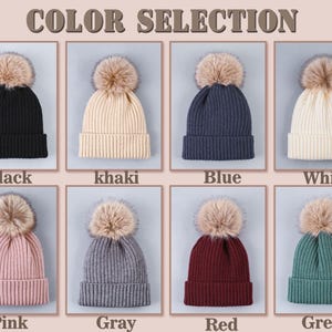 May include: Color selection for knit beanies with faux fur pom poms.  Colors include black, khaki, blue, white, pink, gray, red, and green.