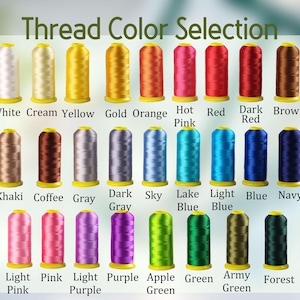 May include: A color chart displaying a "Thread Color Selection" with various thread spools. The spools are arranged in rows and columns, showcasing a wide range of colors, including white, yellow, orange, pink, red, brown, gray, blue, green, and black.