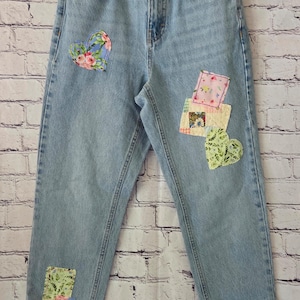 Upcycled Topshop denim jeans with hand-embroidered embellishments. Size 2