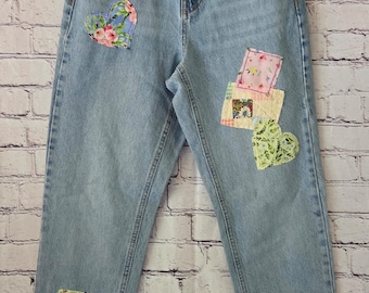 Upcycled Topshop denim jeans with hand-embroidered embellishments. Size 2