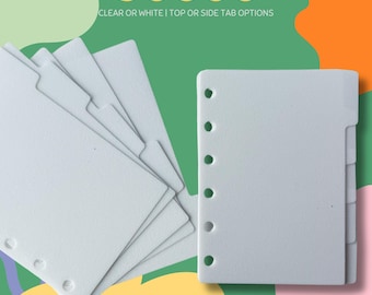 May include: White pocket ring dividers with top or side tab options. The dividers have pre-punched holes for ring binders. Text on the image reads "POCKET RING DIVIDERS" and "CLEAR OR WHITE | TOP OR SIDE TAB OPTIONS".