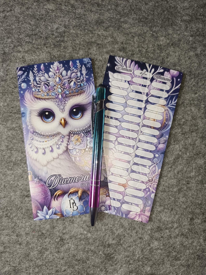May include: A set of Diamora stickers with an owl design, a pen, and a notepad. The owl is white with blue eyes and a jeweled crown. The pen has a metallic finish with blue, purple, and green hues. The notepad has a purple and blue floral design.