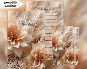 Può includere: Un set di inserti per raccoglitore A6 con un motivo floreale beige, petali stratificati e dettagli piumati. Le pagine riportano il testo Binderübersicht e passend für A6 Binder. La palette di colori è neutra, delicata e calda.
