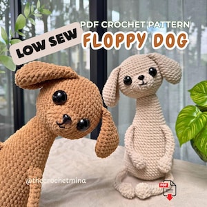 May include: Two crocheted dog plushies, one medium brown and one light beige, featuring large black safety eyes, floppy ears, and long necks. The text reads PDF CROCHET PATTERN LOW SEW FLOPPY DOG and @thecrochetmina with a PDF download icon.