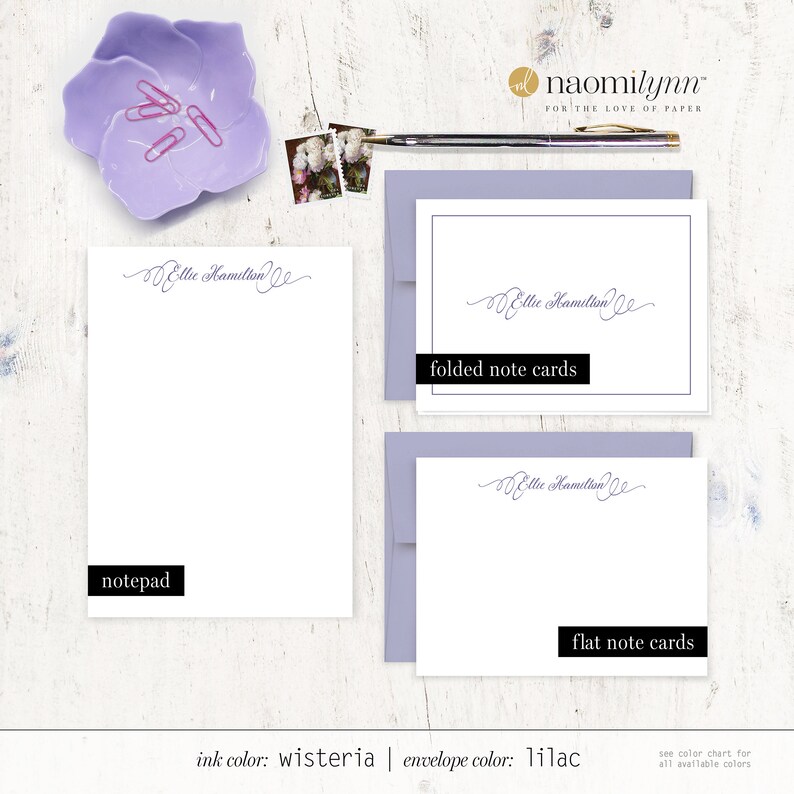 May include: A set of stationery featuring the name "Ellie Hamilton" in a cursive script. The set includes a notepad, folded note cards, and flat note cards. The ink color is wisteria and the envelope color is lilac.