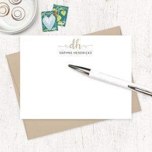 May include: A white card with a brown envelope. The card has a handwritten monogram "dh" with the name "Daphne Hendricks" printed below it.