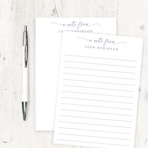 May include: Two white notepads with lined paper. The top of each notepad has the text "a note from" in cursive script followed by the name "LEAH ROBINSON".