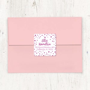 May include: White return address label with a pink polka dot pattern. The text reads "Ellie Hamilton, 765 Round Meadow, #24, Coffeeville, AL 36524".