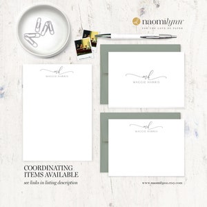 May include: A set of three white stationery note cards with a gray envelope. The note cards feature a simple script font with the name "Maggie Harris" and the initials "mh".