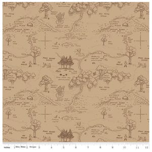 May include: Tan fabric with a detailed map illustration, including text such as "100 Aker Wood" and "Pooh Bear's House." The map features trees, houses, and compass roses, creating a whimsical, storybook aesthetic. The fabric is marked with inches along the bottom.