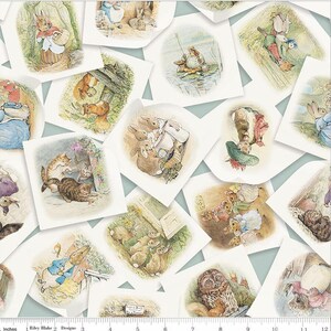 May include: A white fabric with a repeating pattern of colorful illustrations of animals and characters from Beatrix Potter's children's books. The illustrations are framed in white squares with a light blue background. The fabric includes the text "Riley Blake 2 Designs".
