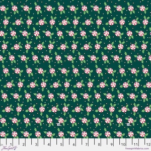 Fabric Free Spirit Mary Engelbreit So Much Joy collection  PWMY016.Green Tossed holly and peppermint Christmas candies on green